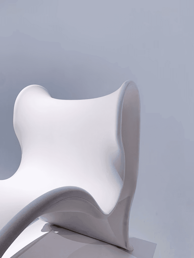 white plastic chair on white surface