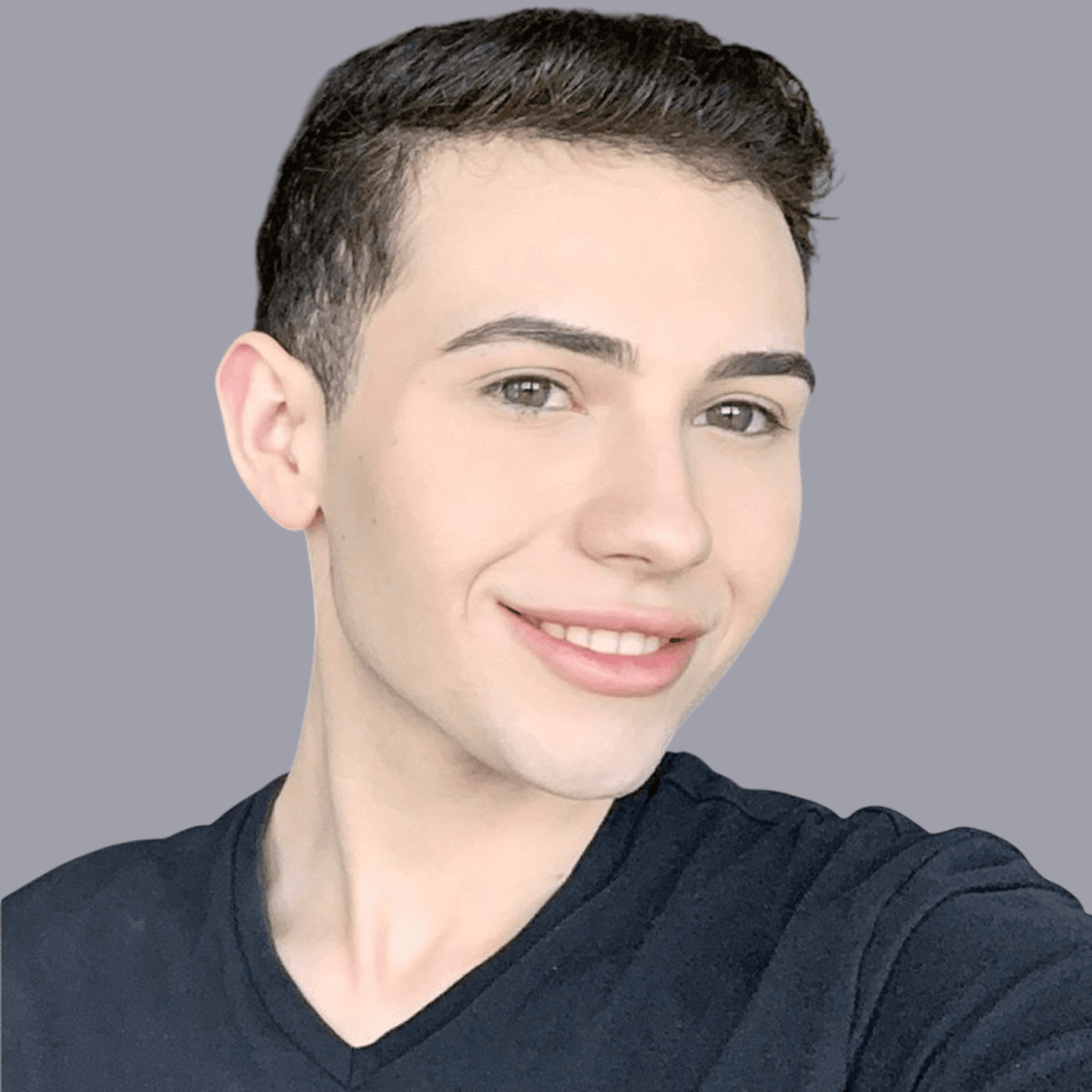 A close-up of a person wearing green-tinted glasses, with a serious expression and smooth skin.