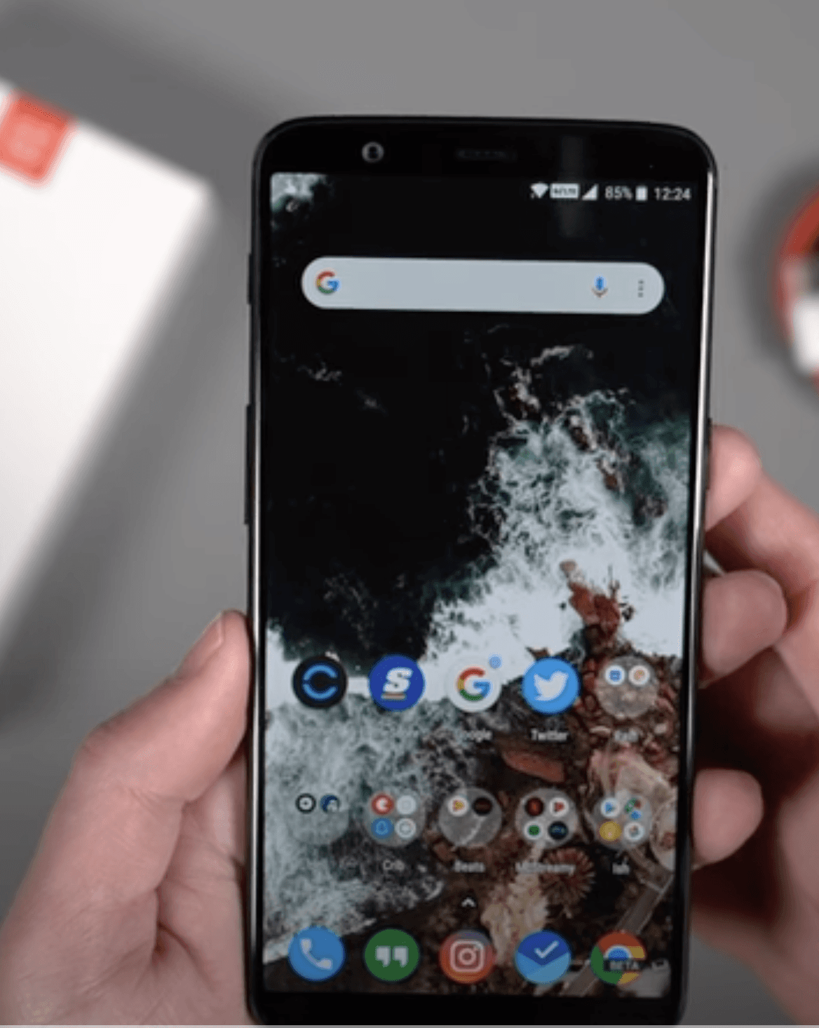 person holding white and black checkered card