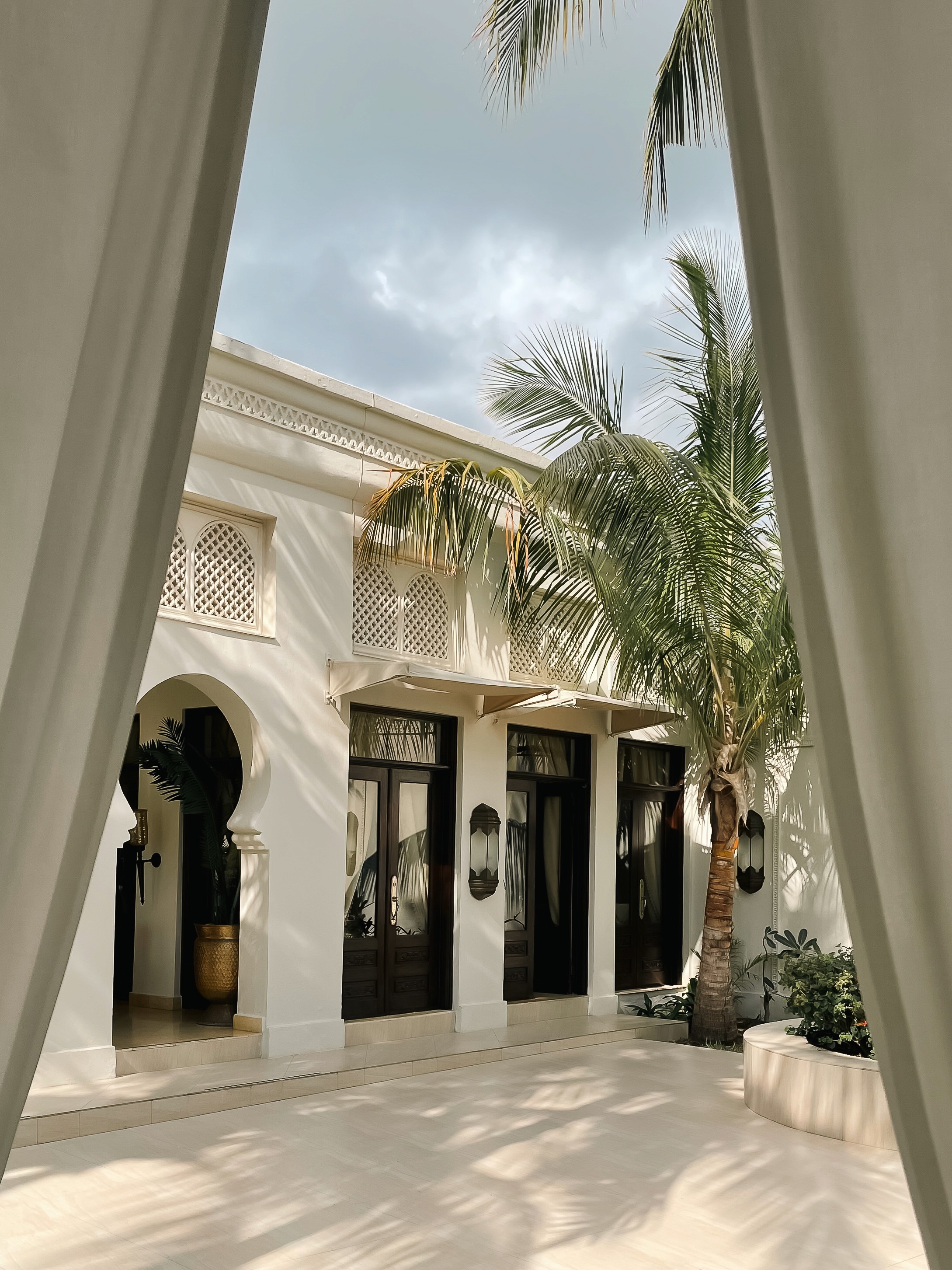 Young woman looking out a window at night
