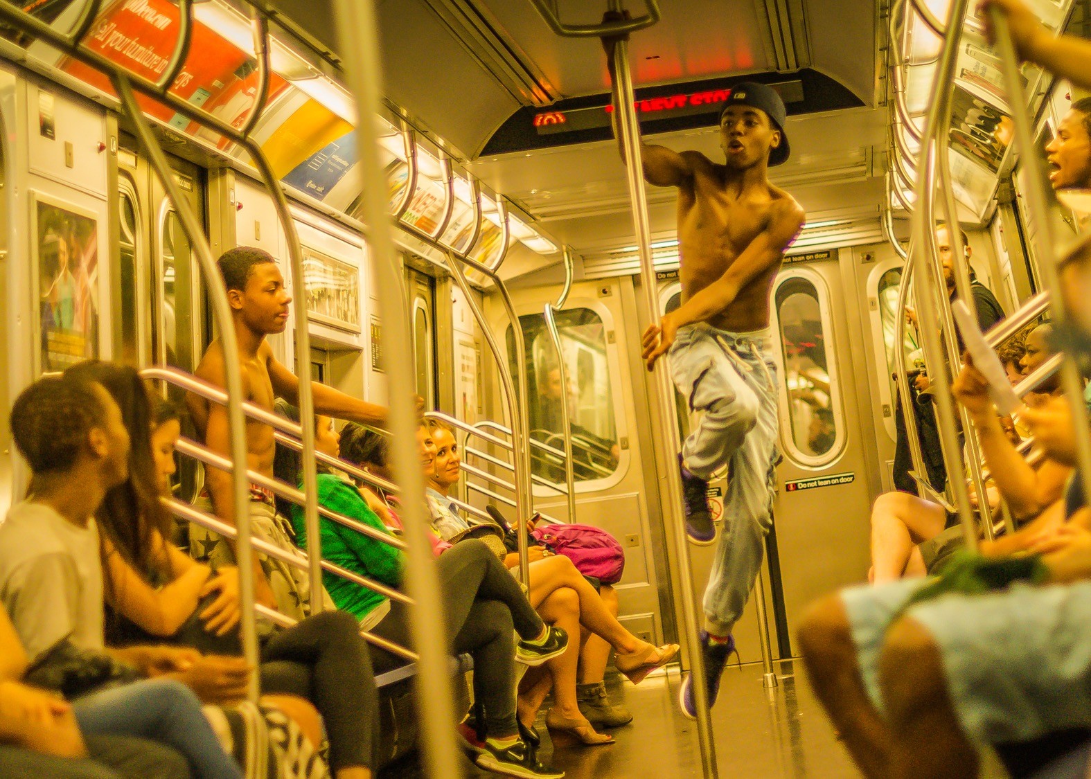 Subway dancers on the L train in Brooklyn, NY.