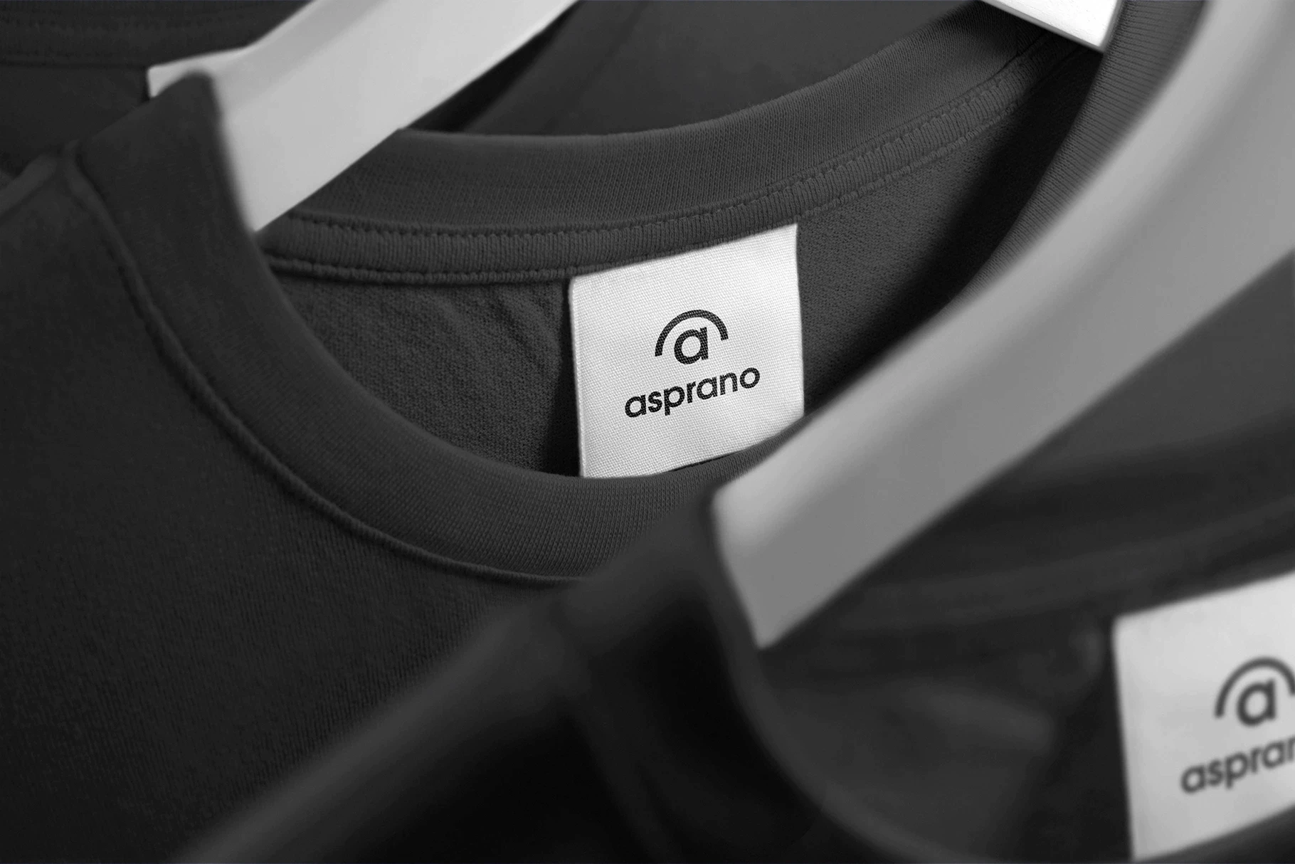 The customizable clothing label mockup displayed on a classic black t-shirt.