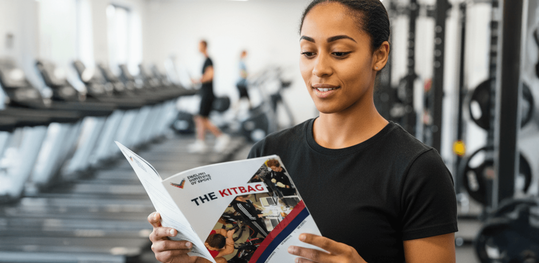 A woman is reading the kitbag a document created by BB Visual.  