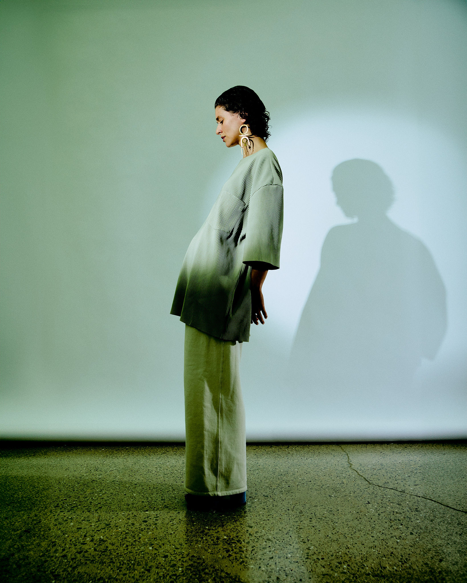 Woman with red hair covering mouth with hair