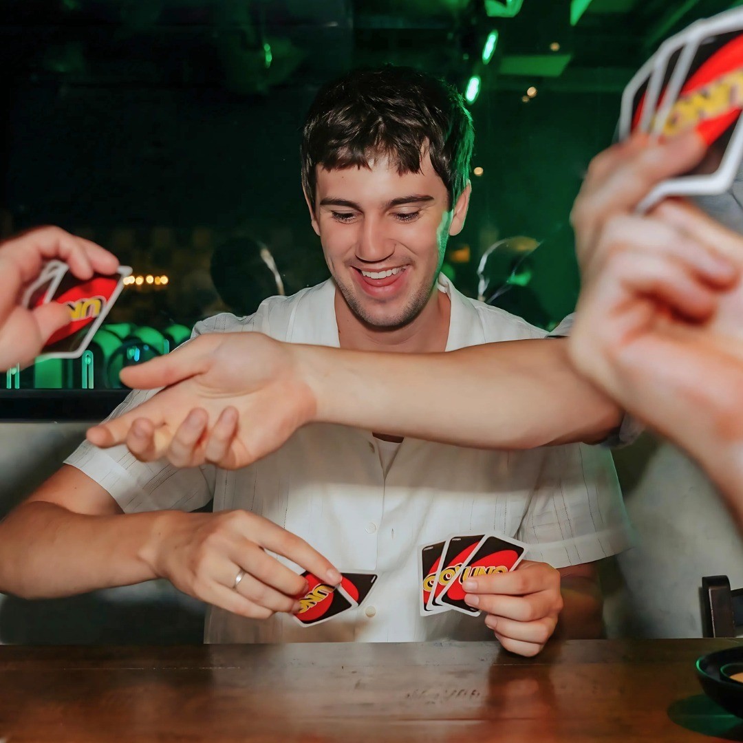 Someone sitting in front of a computer playing a video game in the Lan Lounge at Fortress