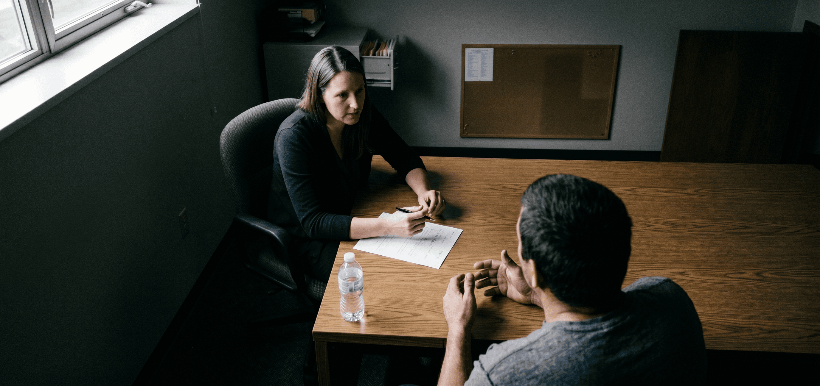 Clinician speaking to man