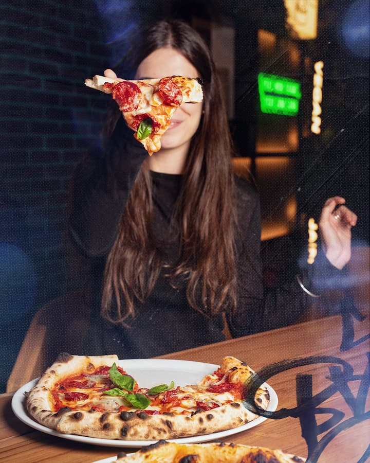 Pizza shared as iftar dishes during ramadan.