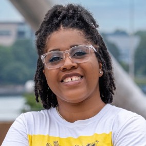 Possible member smiling and looking at the camera.