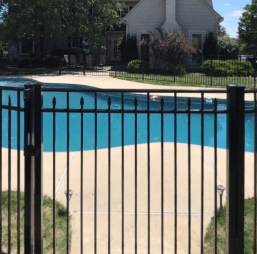 Close up of powder-coated black aluminum fence pickets and rails