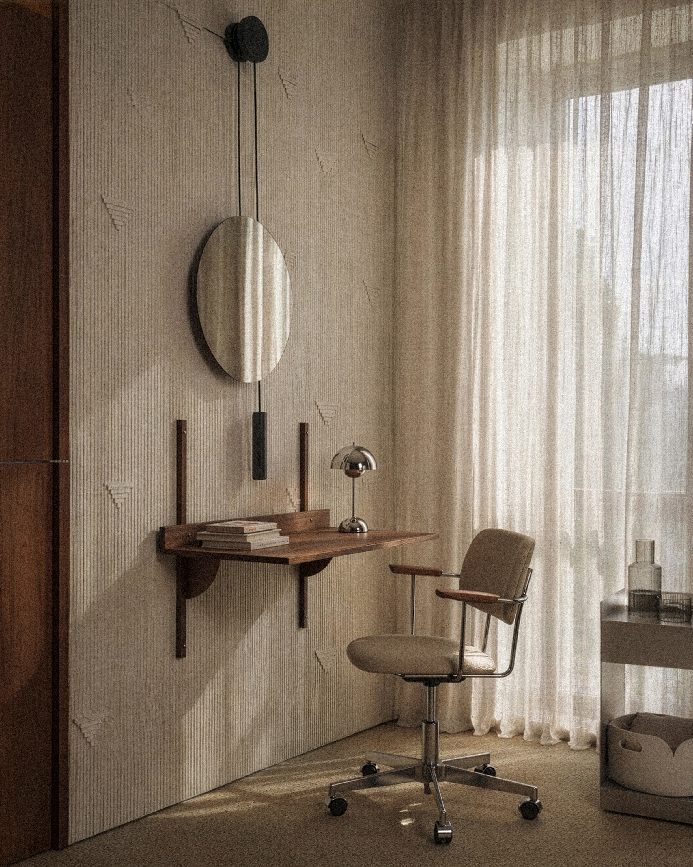 Custom wall-mounted walnut desk with integrated shelving, mirror and upholstered office chair creating a minimalist workspace