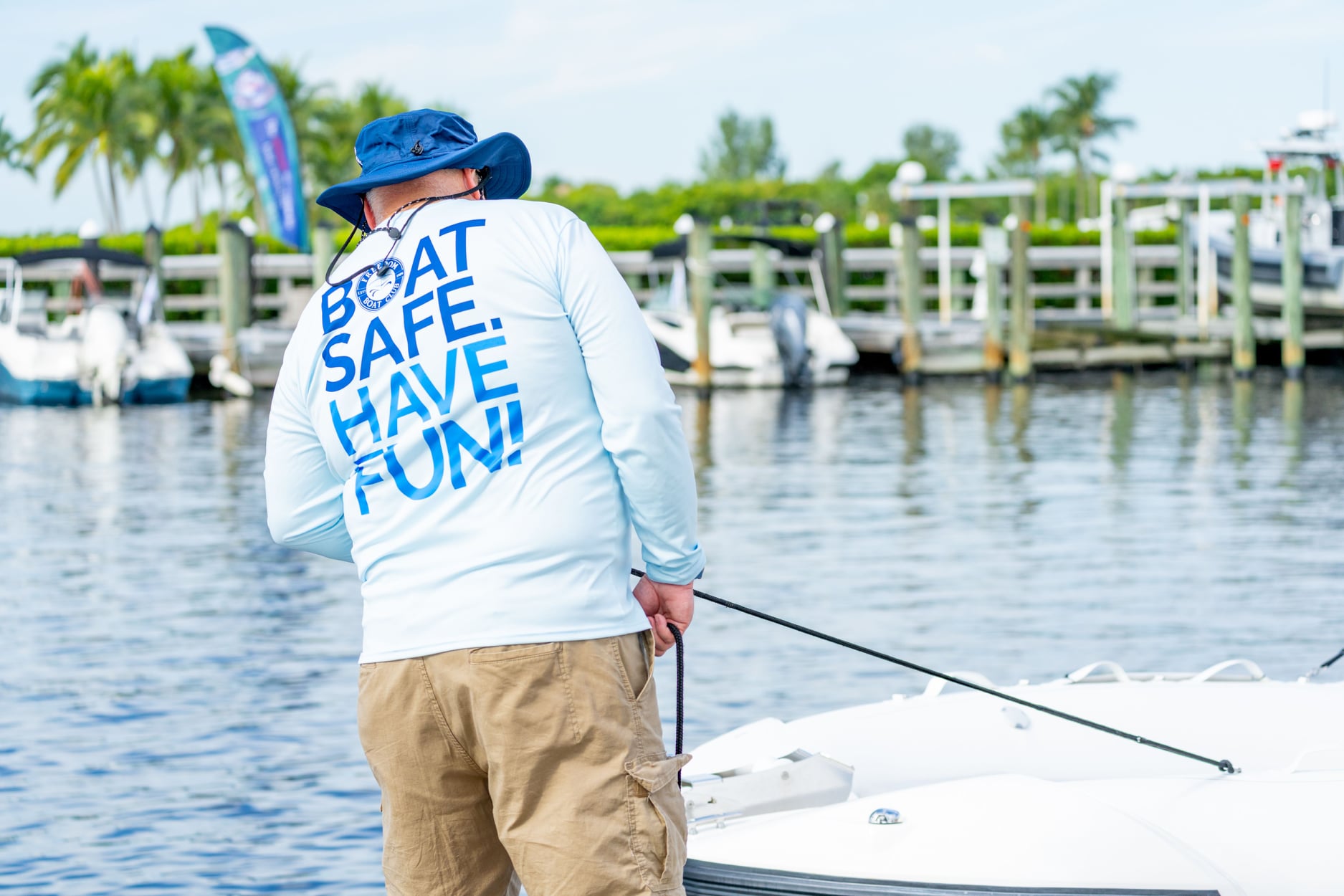 man cleaning boat at stump pass marina
