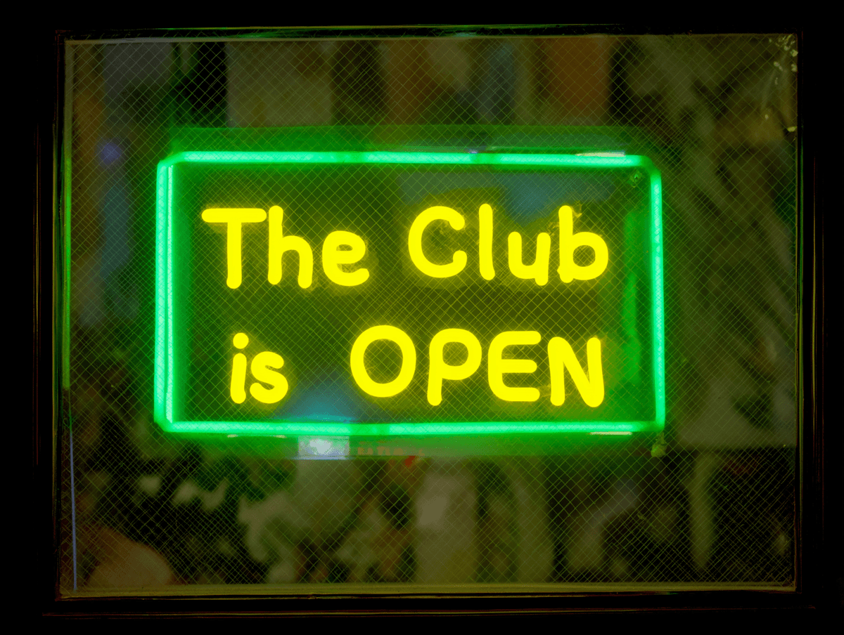 man holding white ceramic teacup