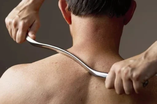 physiotherapist performing joint mobilization on patient’s shoulder