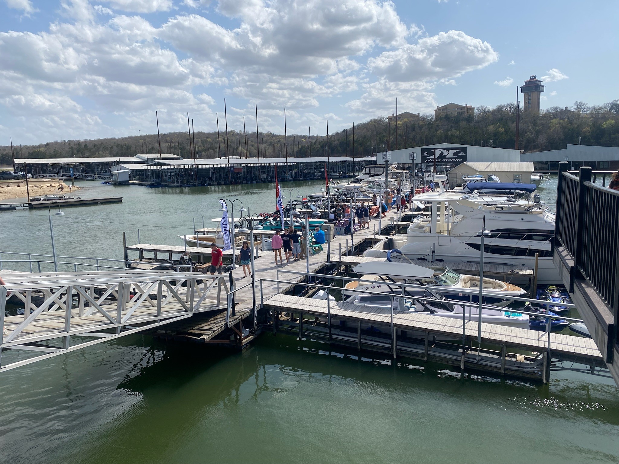 white and blue boat on sea during daytime