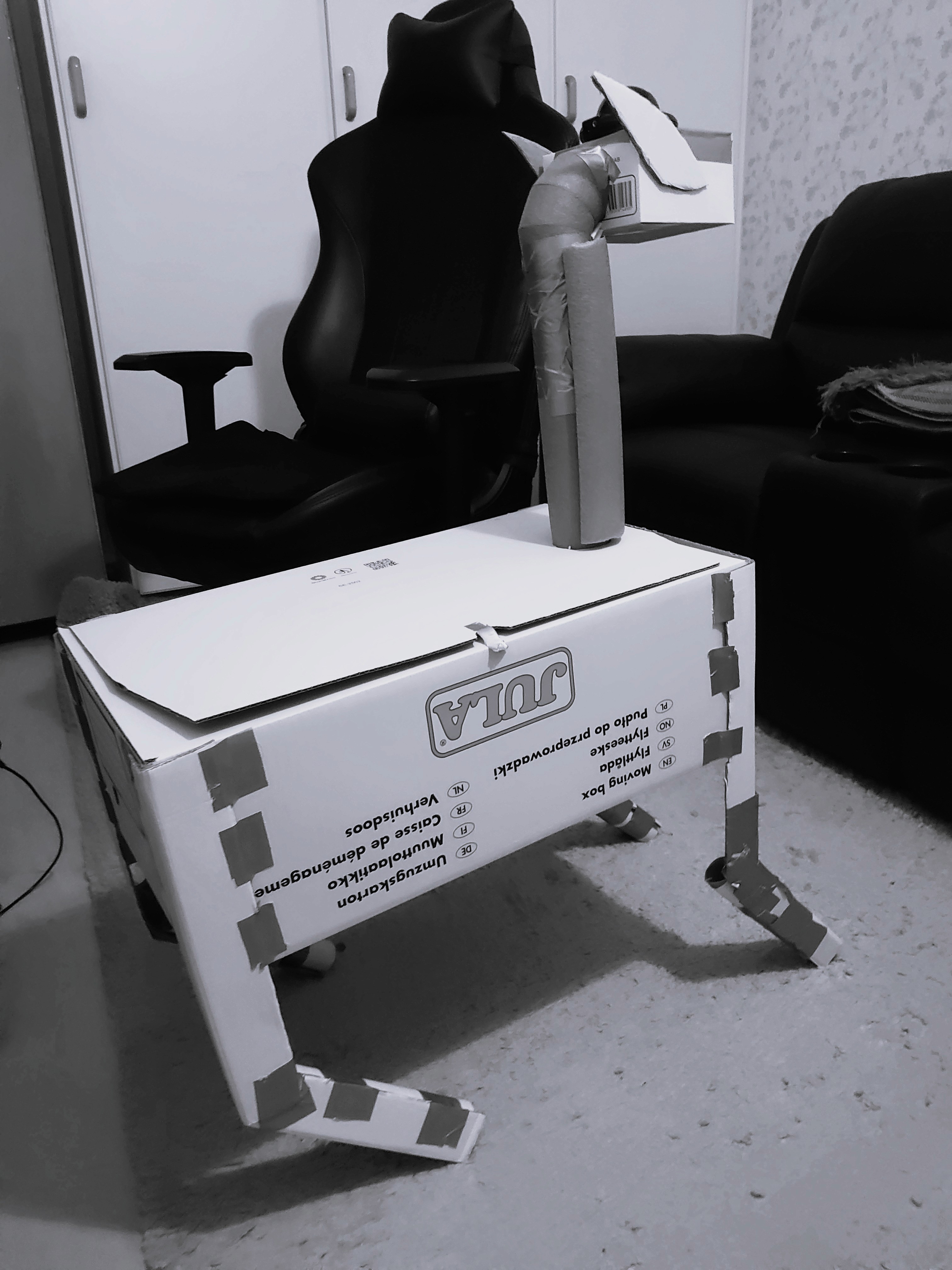 a black cellphone with a white letter on it