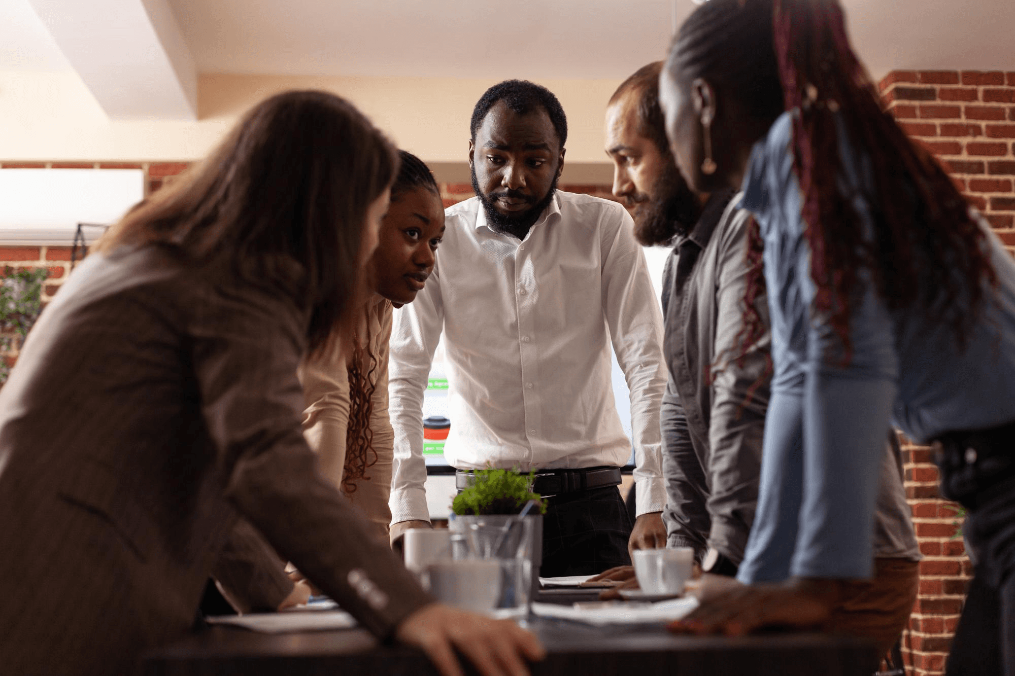 Startup founder and HR specialist reviewing people plans together