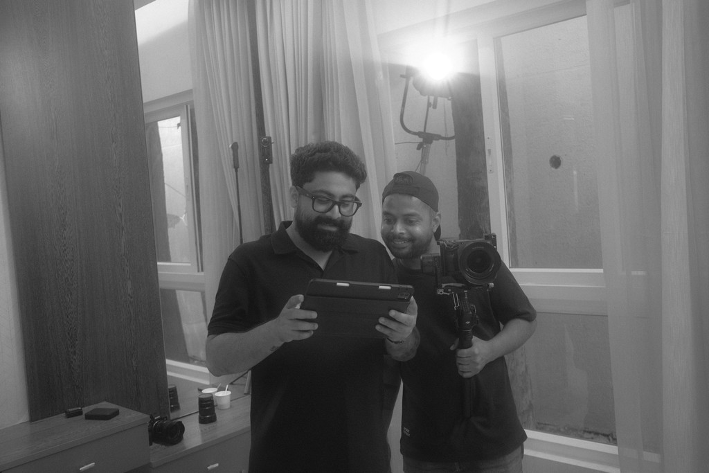 The Red Productions founder and videographer discussing a scene