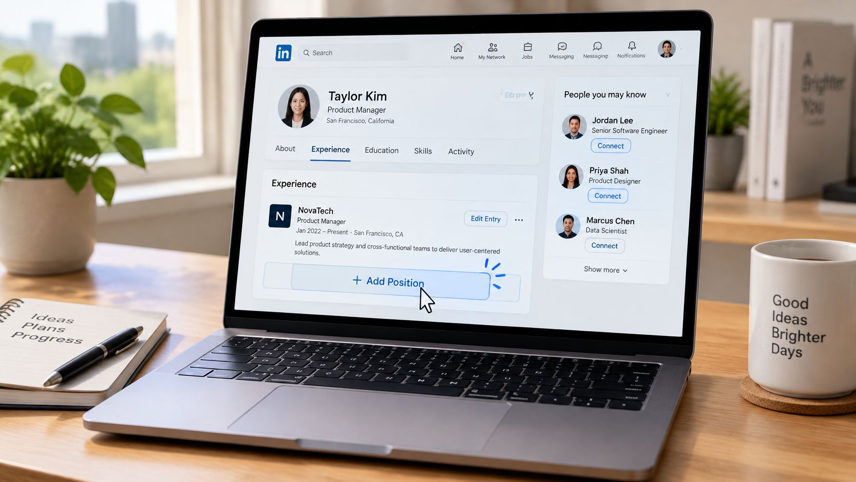 A laptop screen displaying a LinkedIn profile page with a cursor hovering over the add position button.