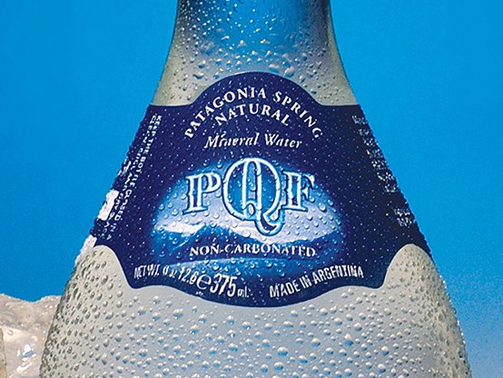 Rustic cabin in a golden field at sunset