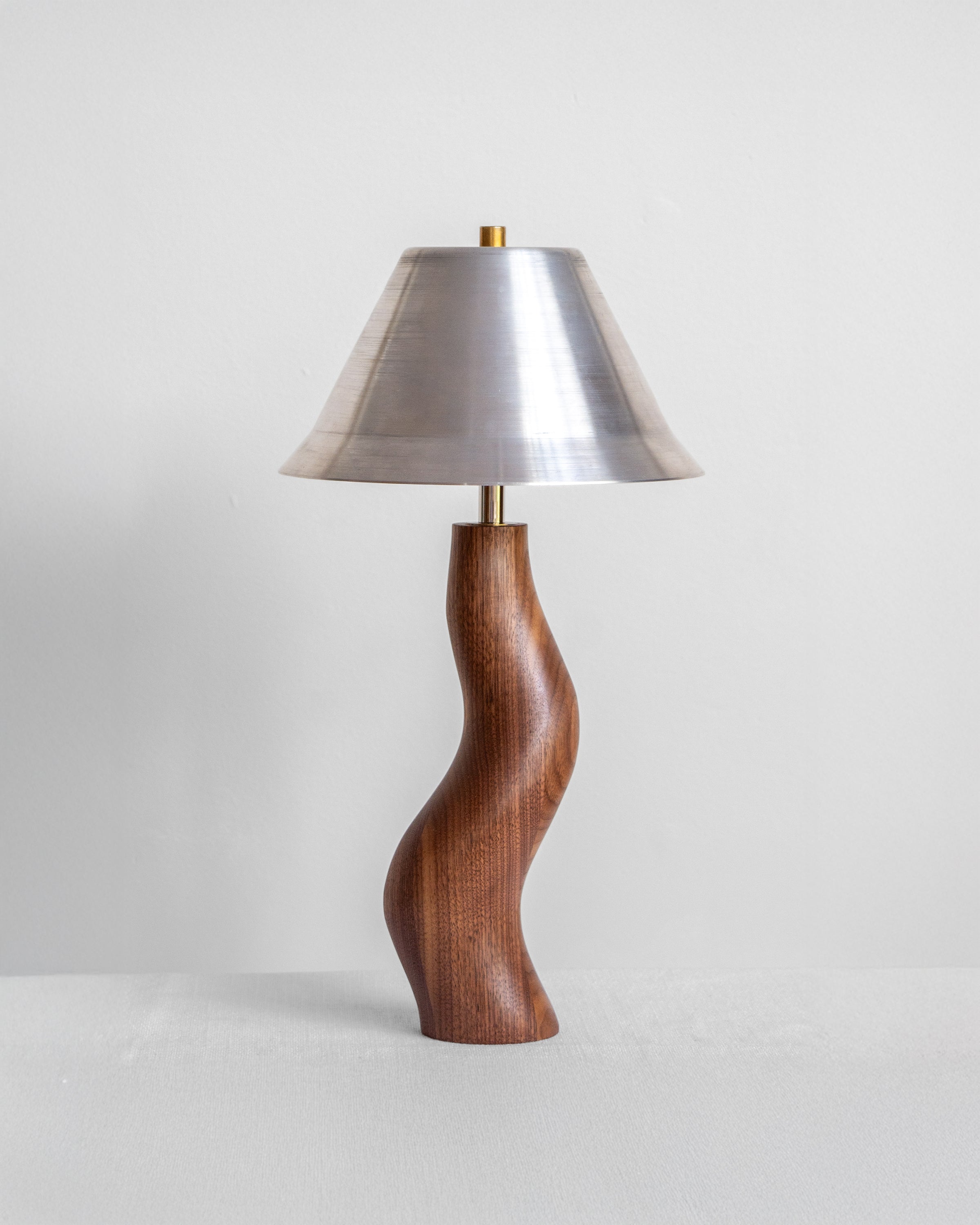 Dancing Desk Lamp with Walnut base and Aluminium shade on a light grey background with UK, EU and US/CA wiring available Wilkinson & Rivera