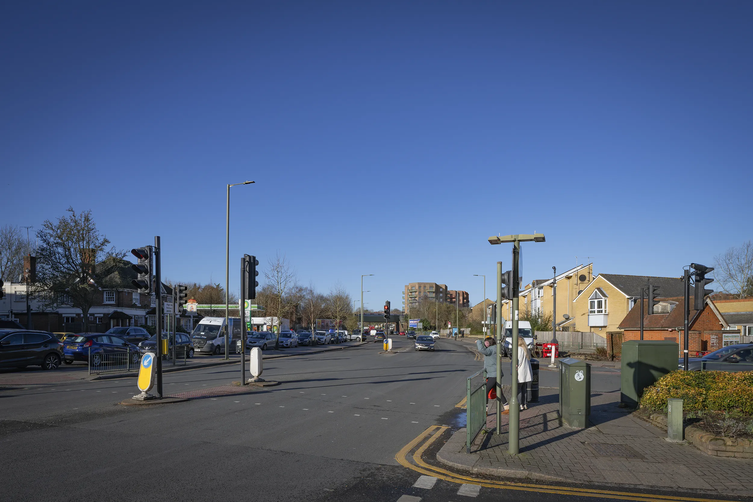 Type 4 AVR Level 3 verified view looking south west along Great North Road at the junction with Station Road, High Barnet, with the upper levels of Buildings C, D and E on the skyline beyond the railway bridge. Produced by Eye-kon.