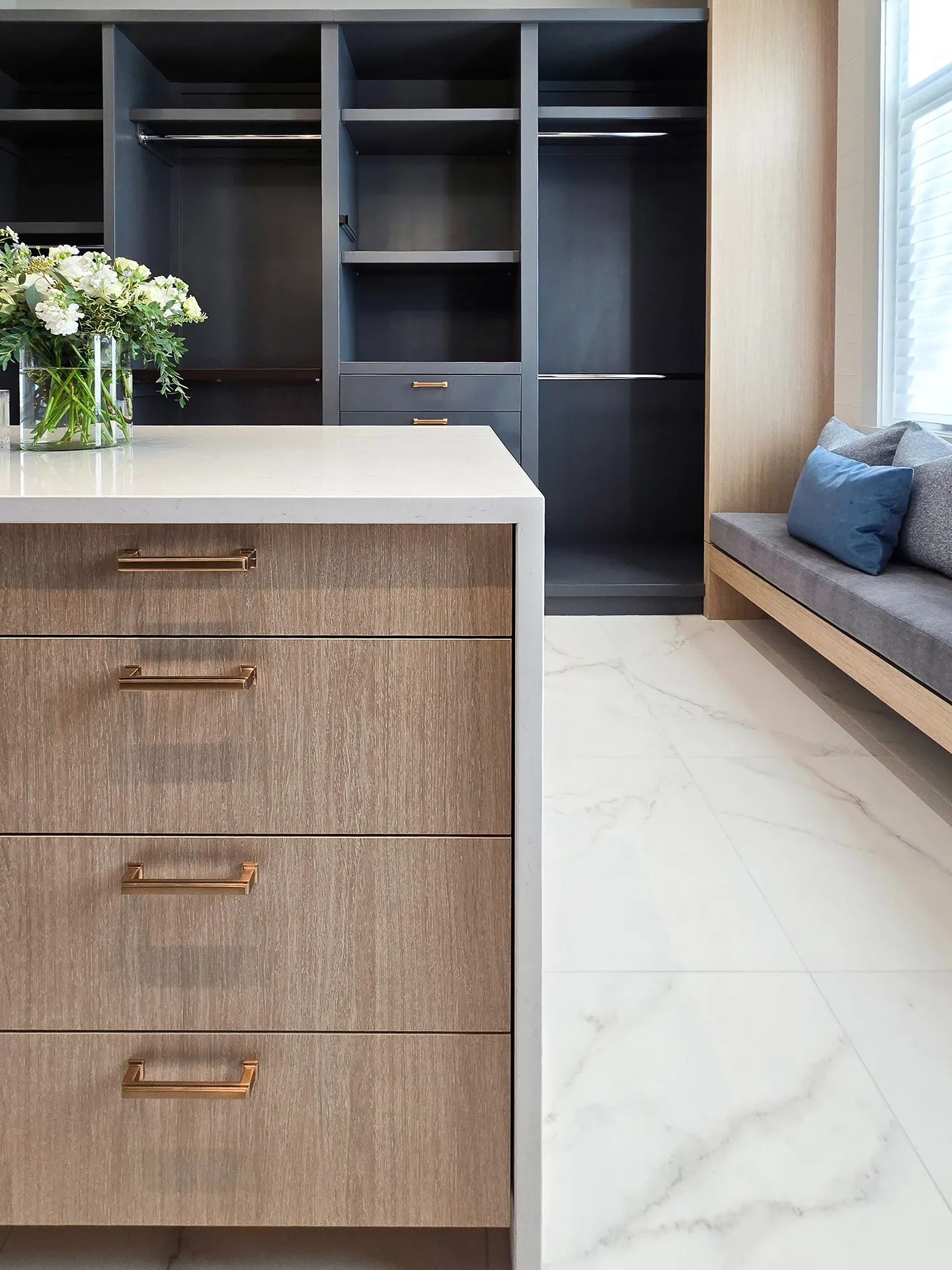 Image of "KHD Homes interior design featuring a luxurious primary ensuite with custom closet and marble flooring."