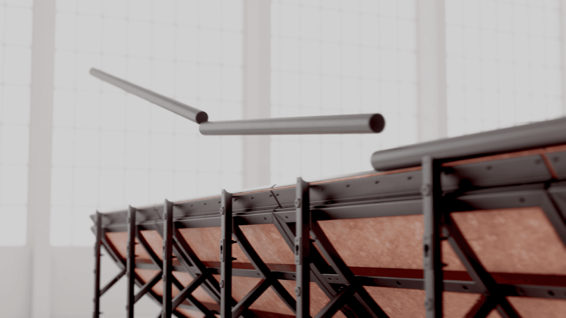 Coping tubes being attached to the top of the mini ramp riding surface