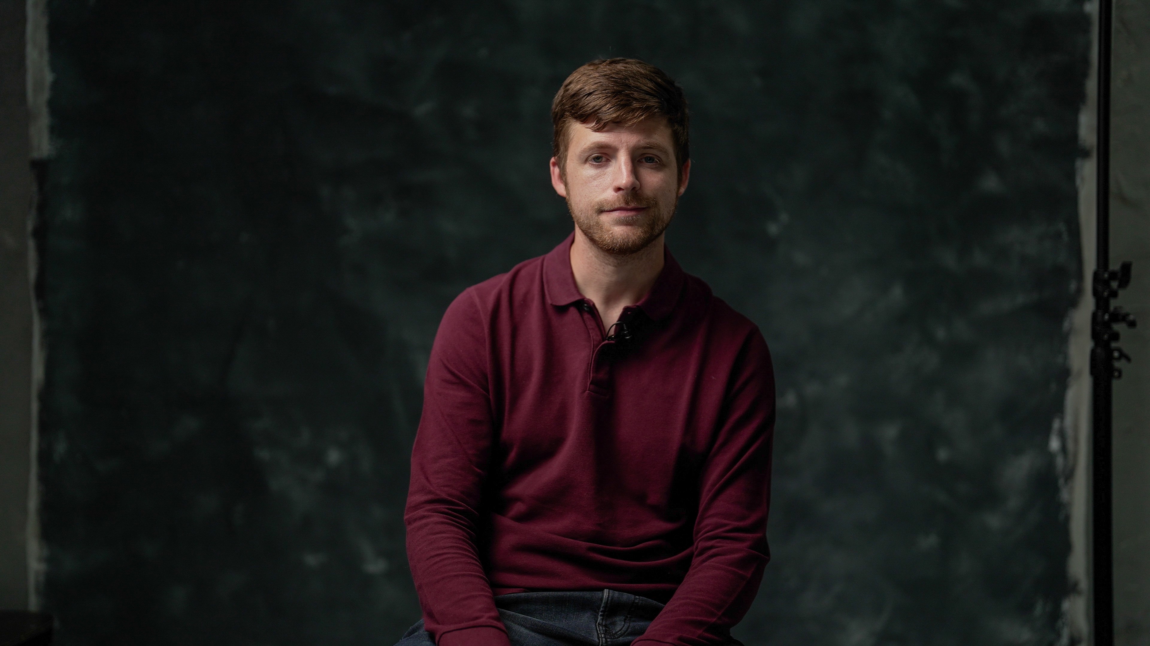 a studio shot of a man in an interview chair as part of IPS grows recruitment campaign