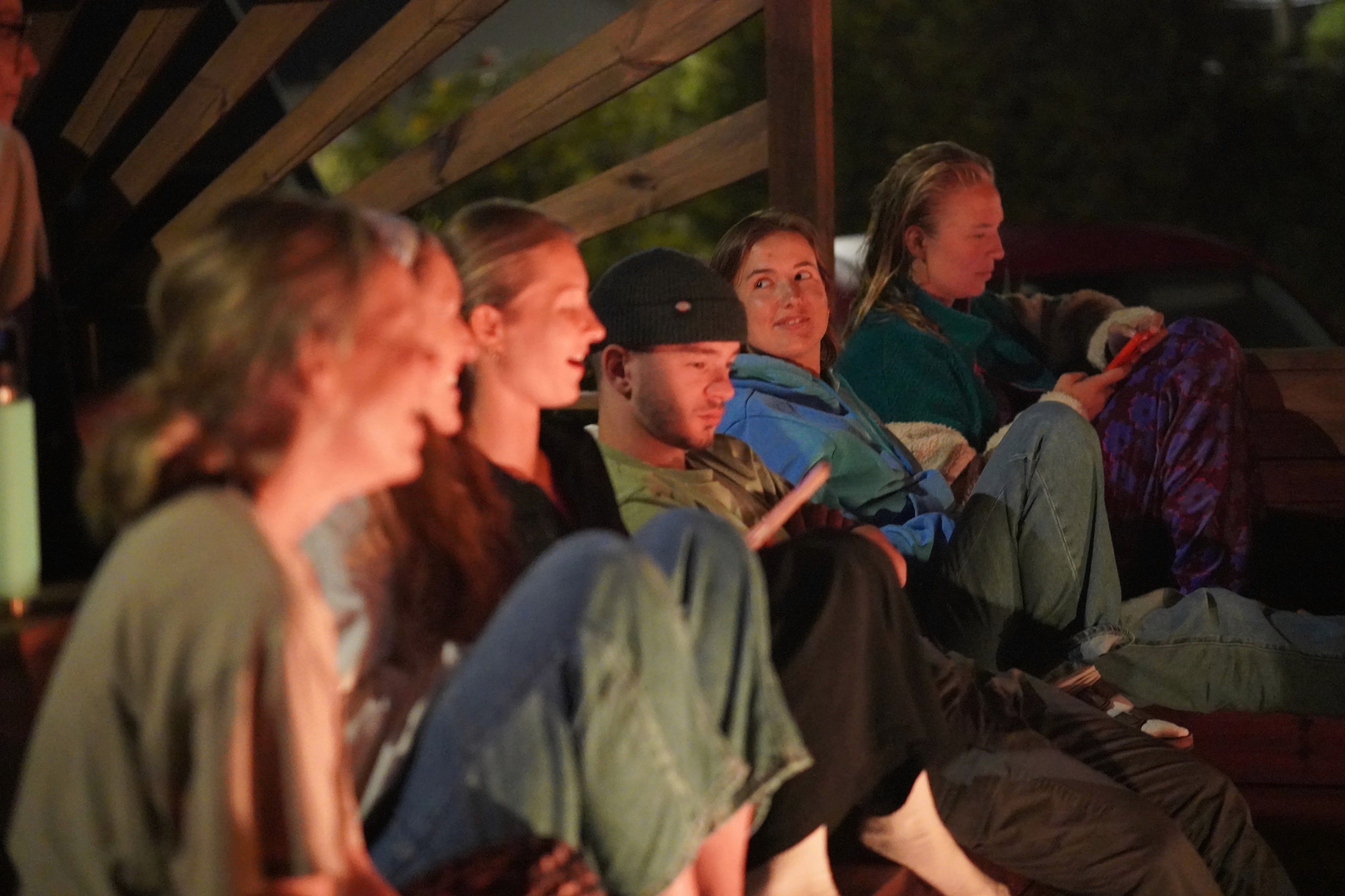 guests sitting by the bonfire