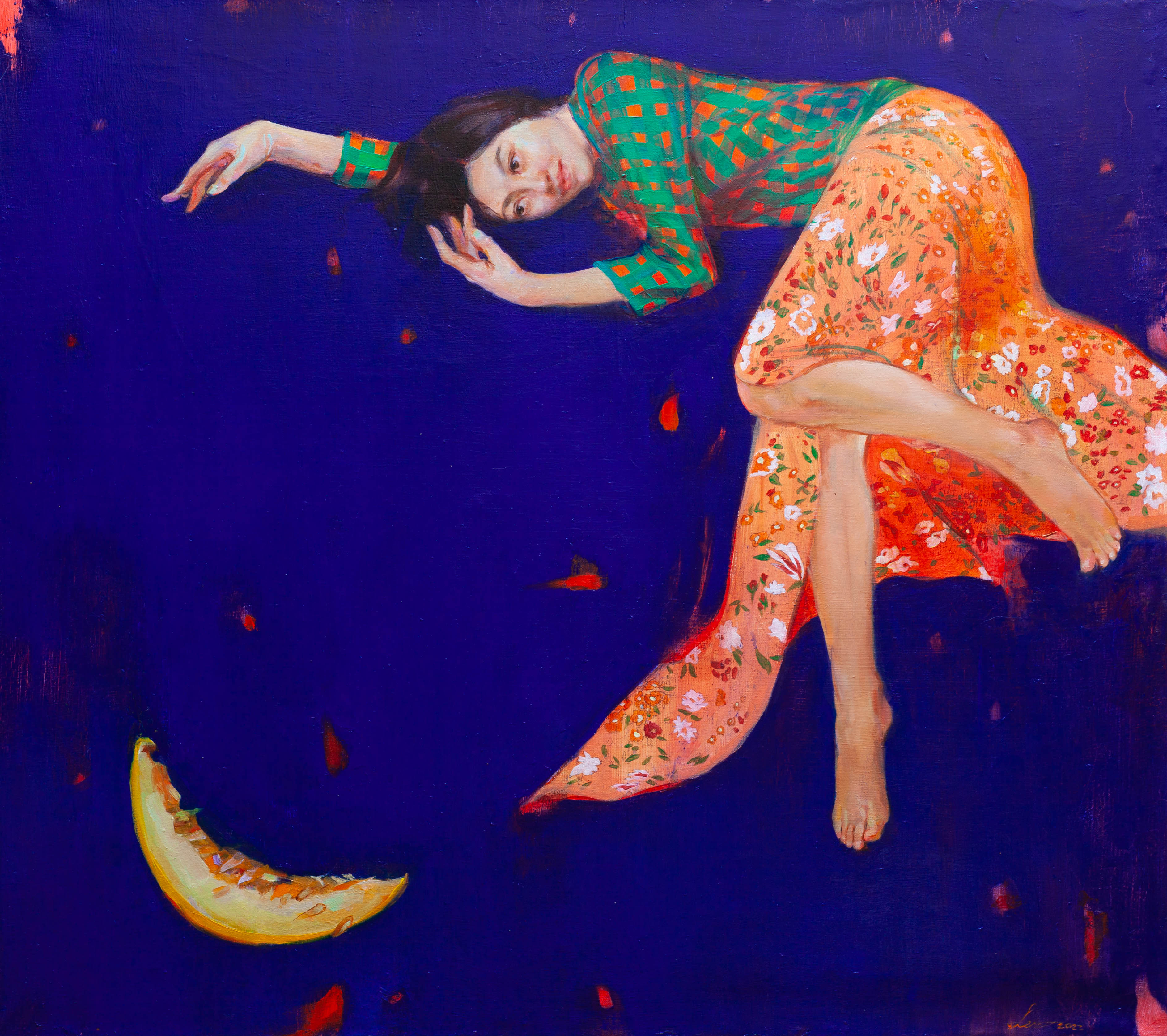 A woman in colorful, flowing attire appears to be floating in a dreamlike, dark blue space alongside a crescent moon-shaped object, evoking a sense of surrealism and ethereal beauty.
