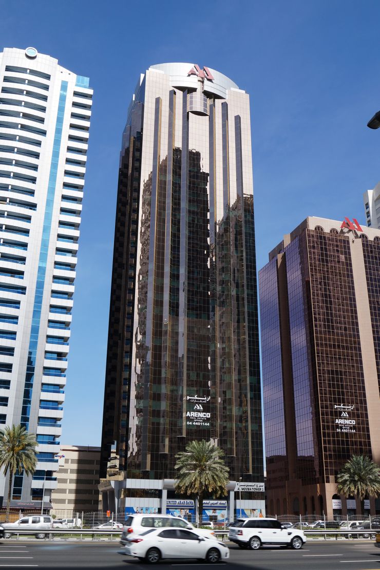 Wide shot of commercial buildings. Real estate agent services for listings in Al Moosa Tower 2 and vicinity.