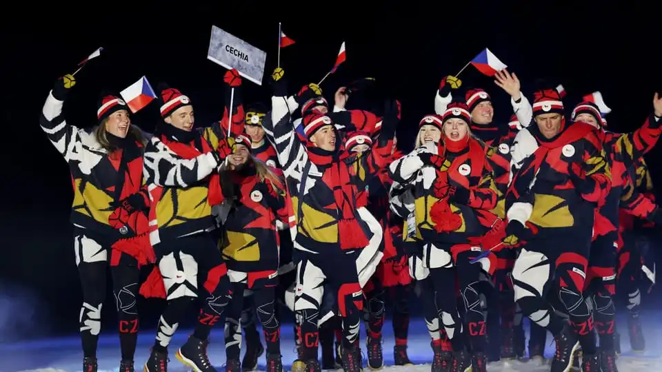 Athletes from Czechia waving Czech flags.
