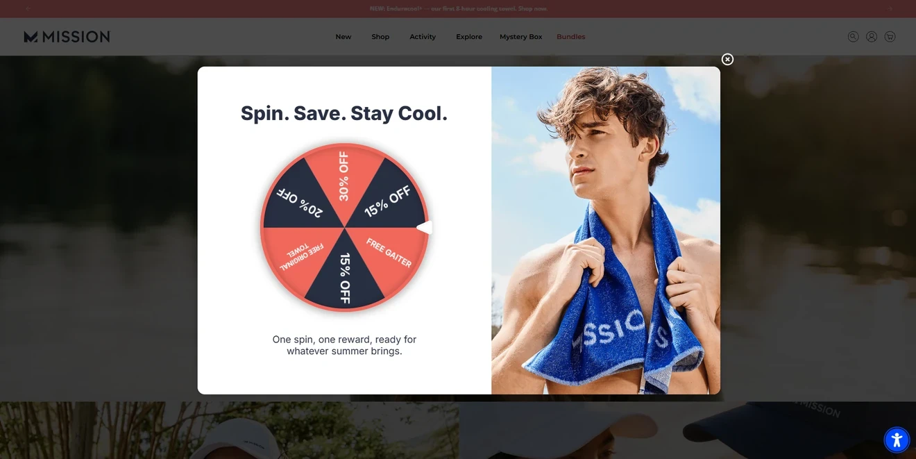 Mission gamified newsletter popup with a prize wheel offering discounts and a free gaiter before email signup.