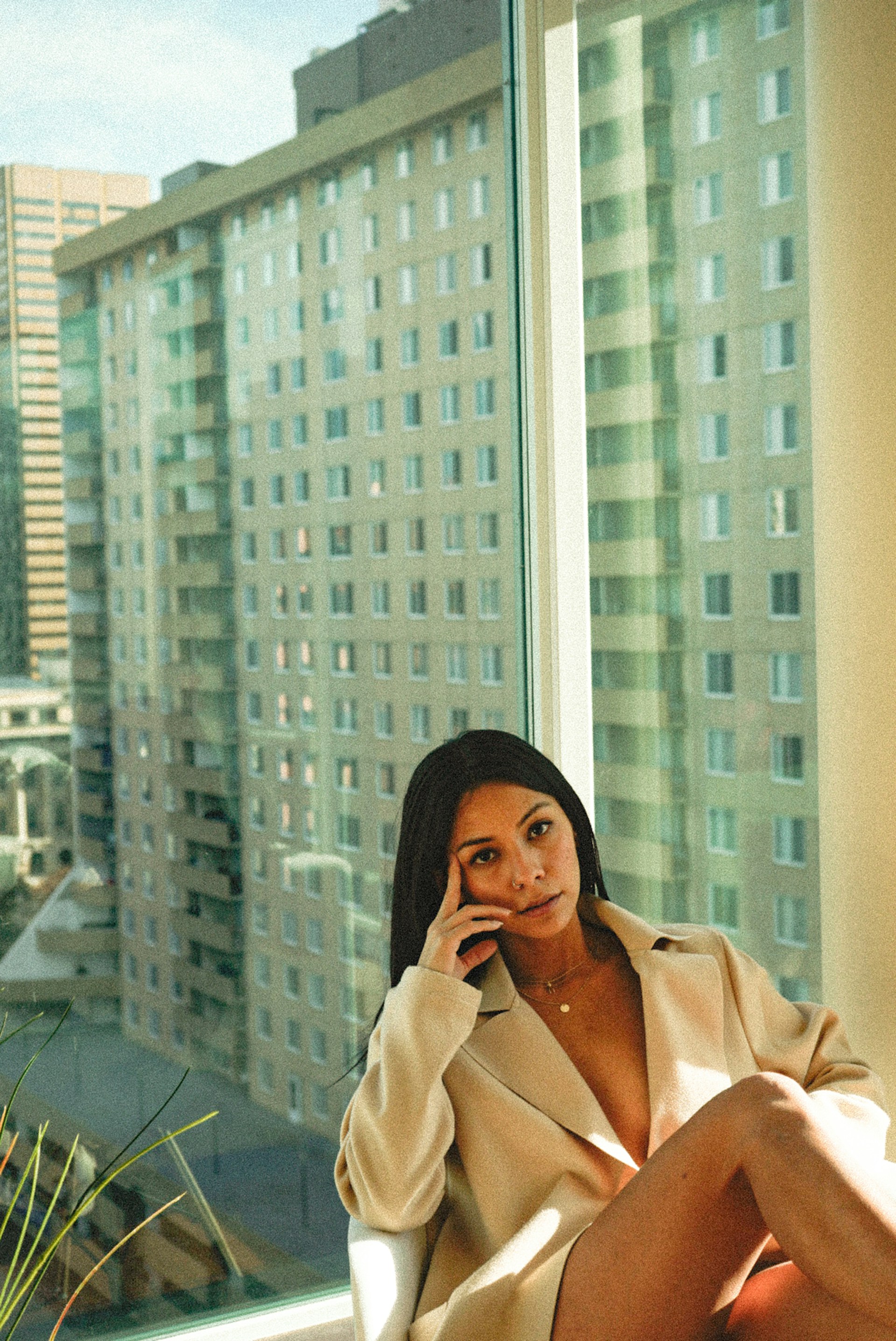 Woman relaxed sitting and posing to the camera