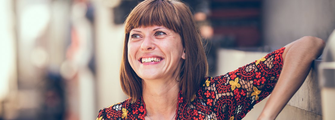 a smiling middle-aged woman