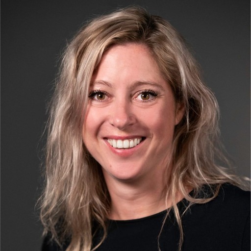 Headshot of a smiling, blonde woman