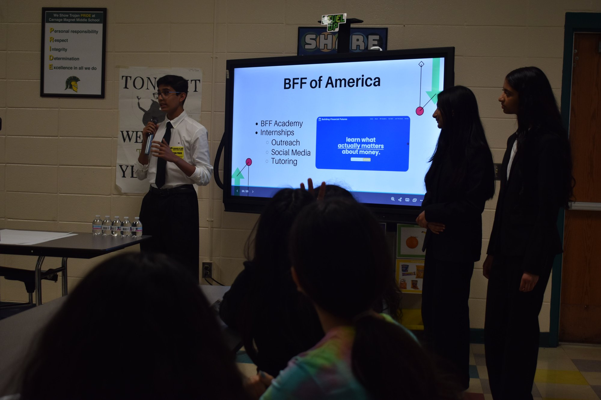 BFF presenters leading a financial literacy lesson at Carnage Middle School.