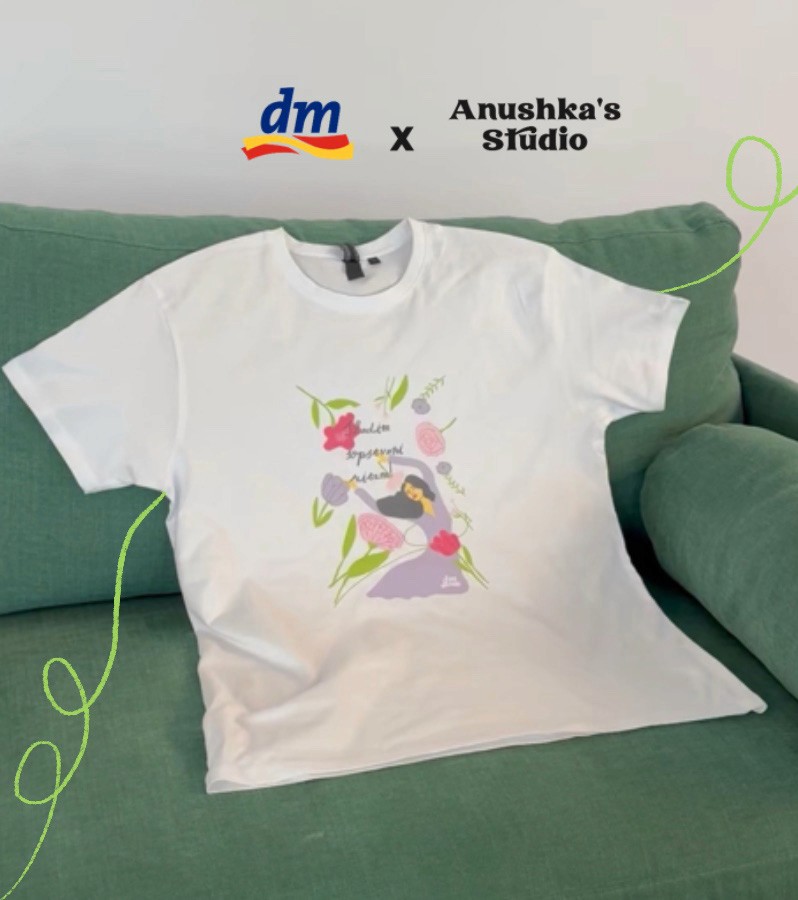 A close-up of a pink cocktail in a martini glass, set against a nighttime background with soft, blurred colors.