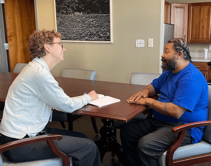 A JFS care manager works one-on-one with a client.