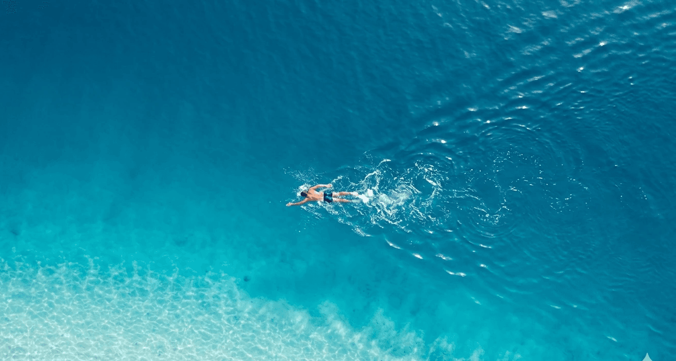 Person Swiming in a ocean