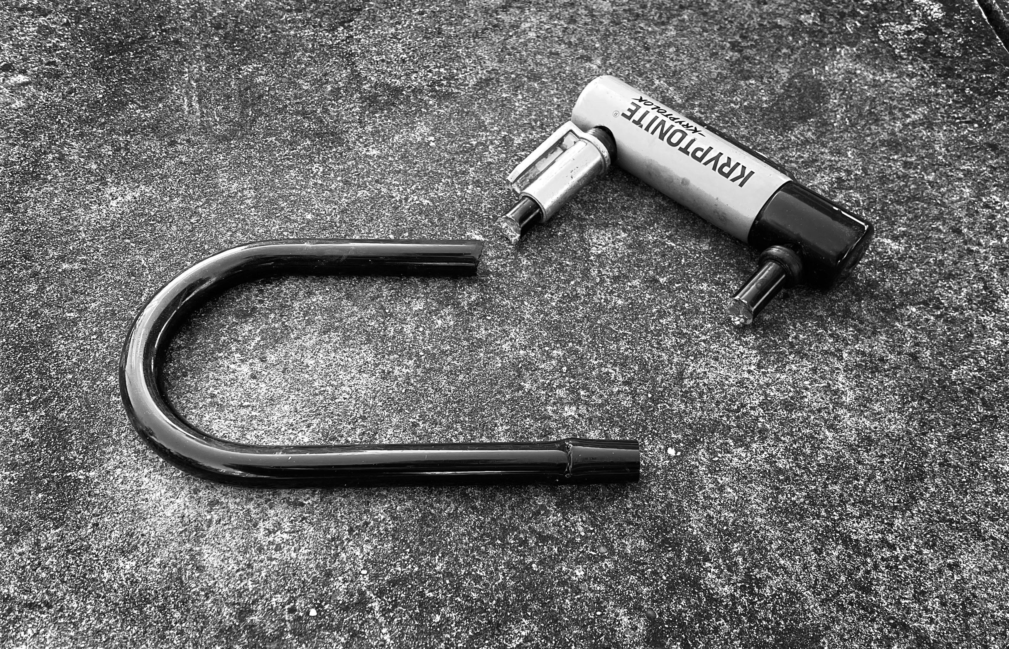 a black and white photo of a hair dryer laying on the ground