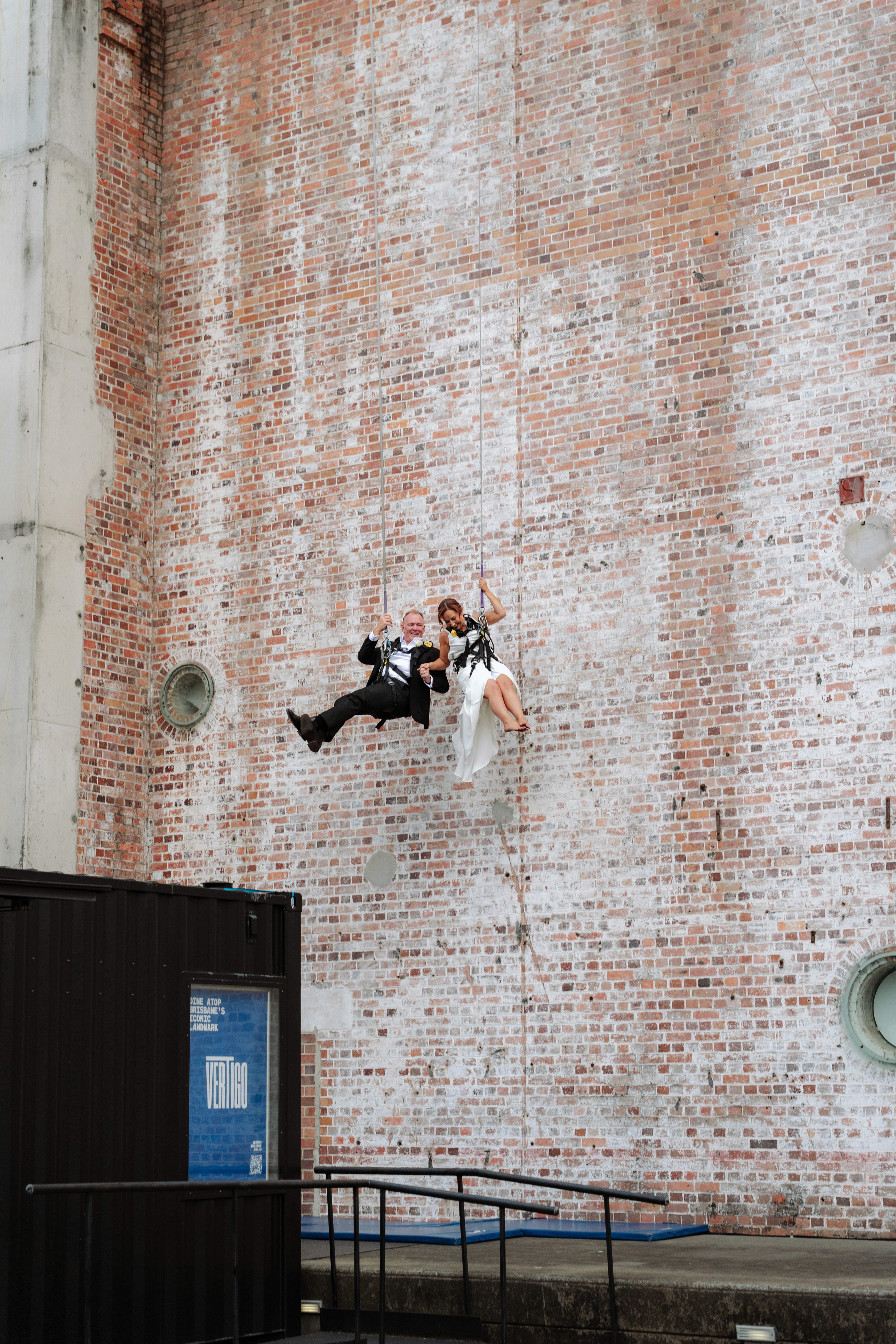 Craig & Ammie jumping off the Brisbane Powerhouse at the Vertigo restaurant