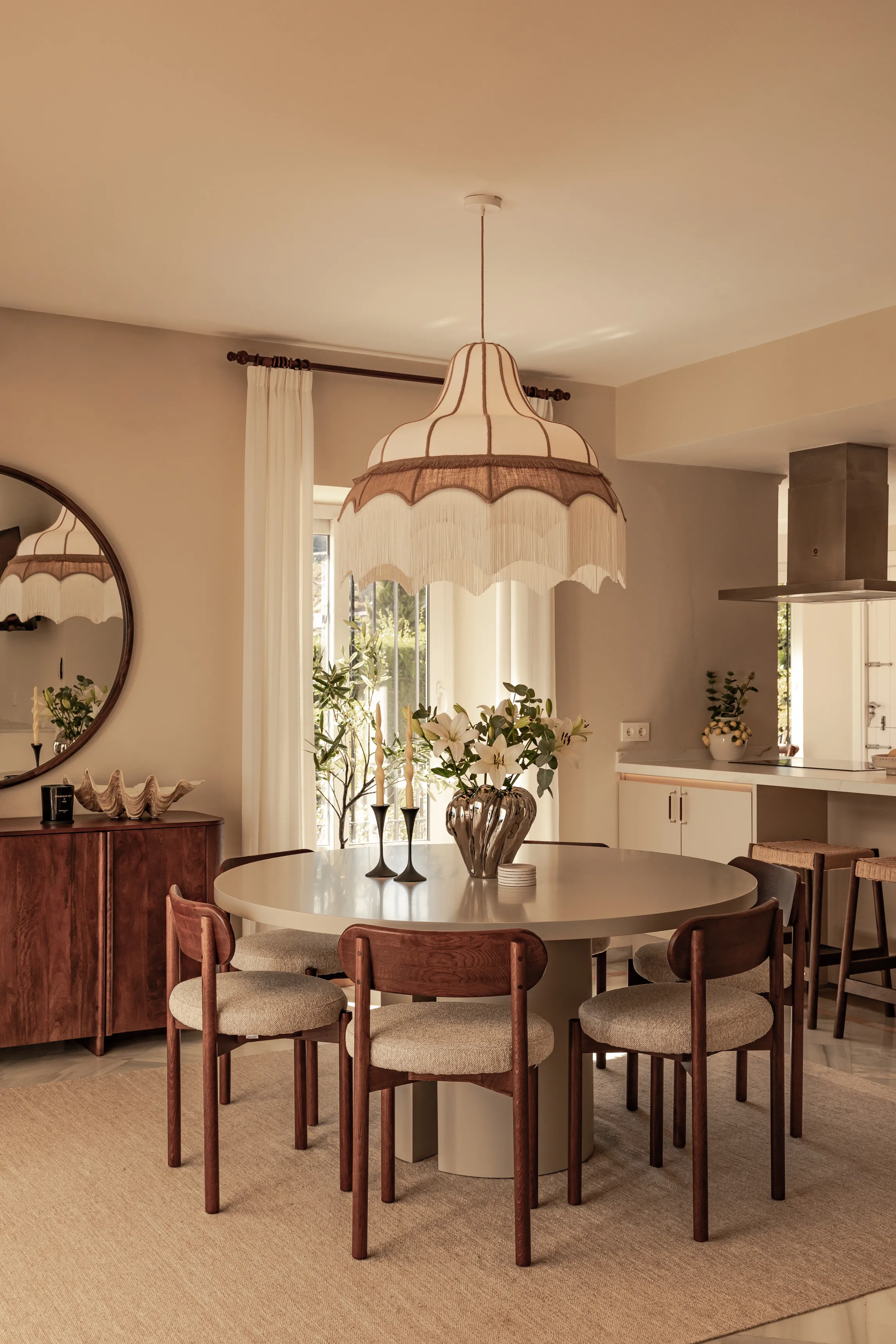 Dining area with bespoke lighting, natural materials and Mediterranean-inspired interiors.
