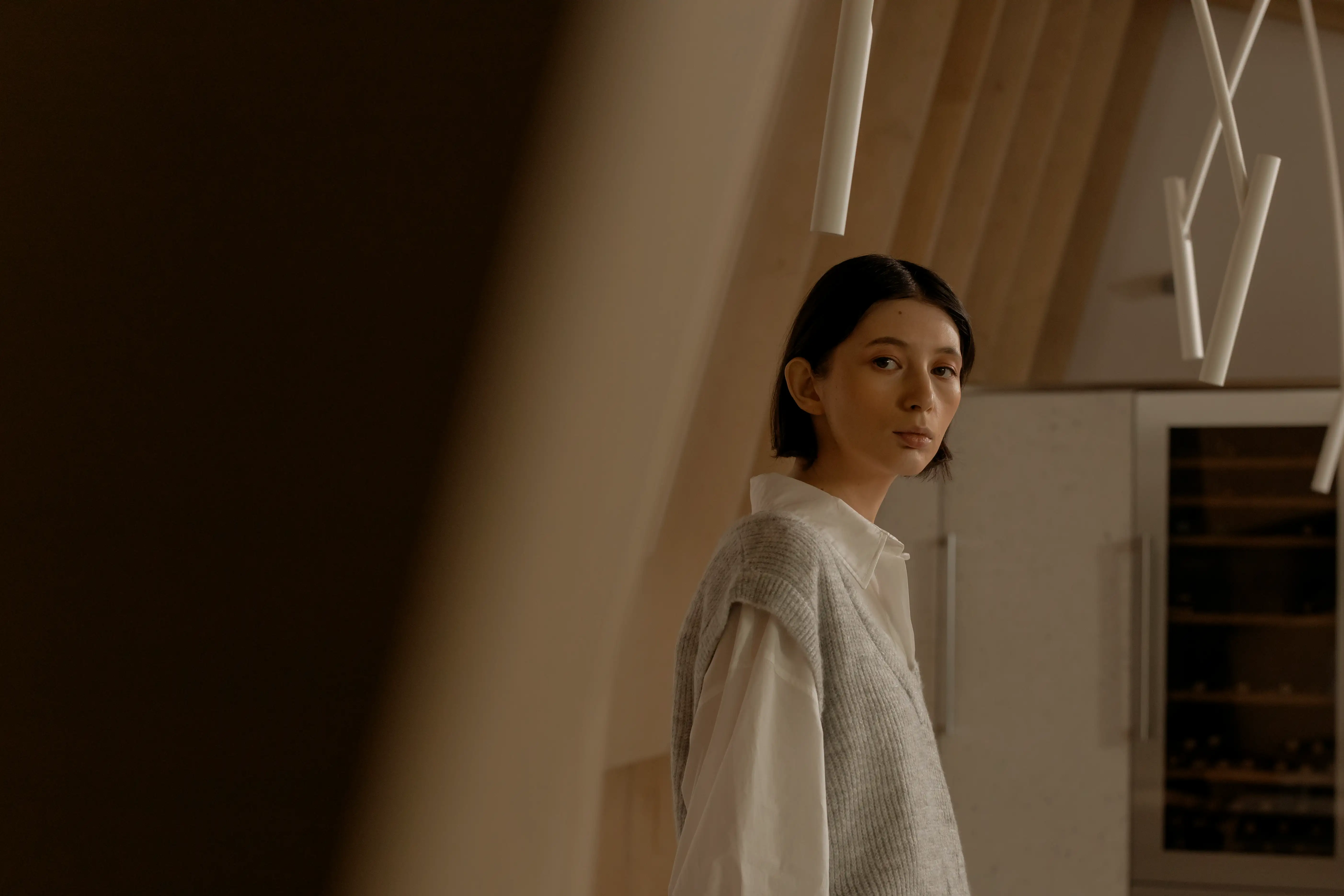 A lady looking in the direction of the viewer