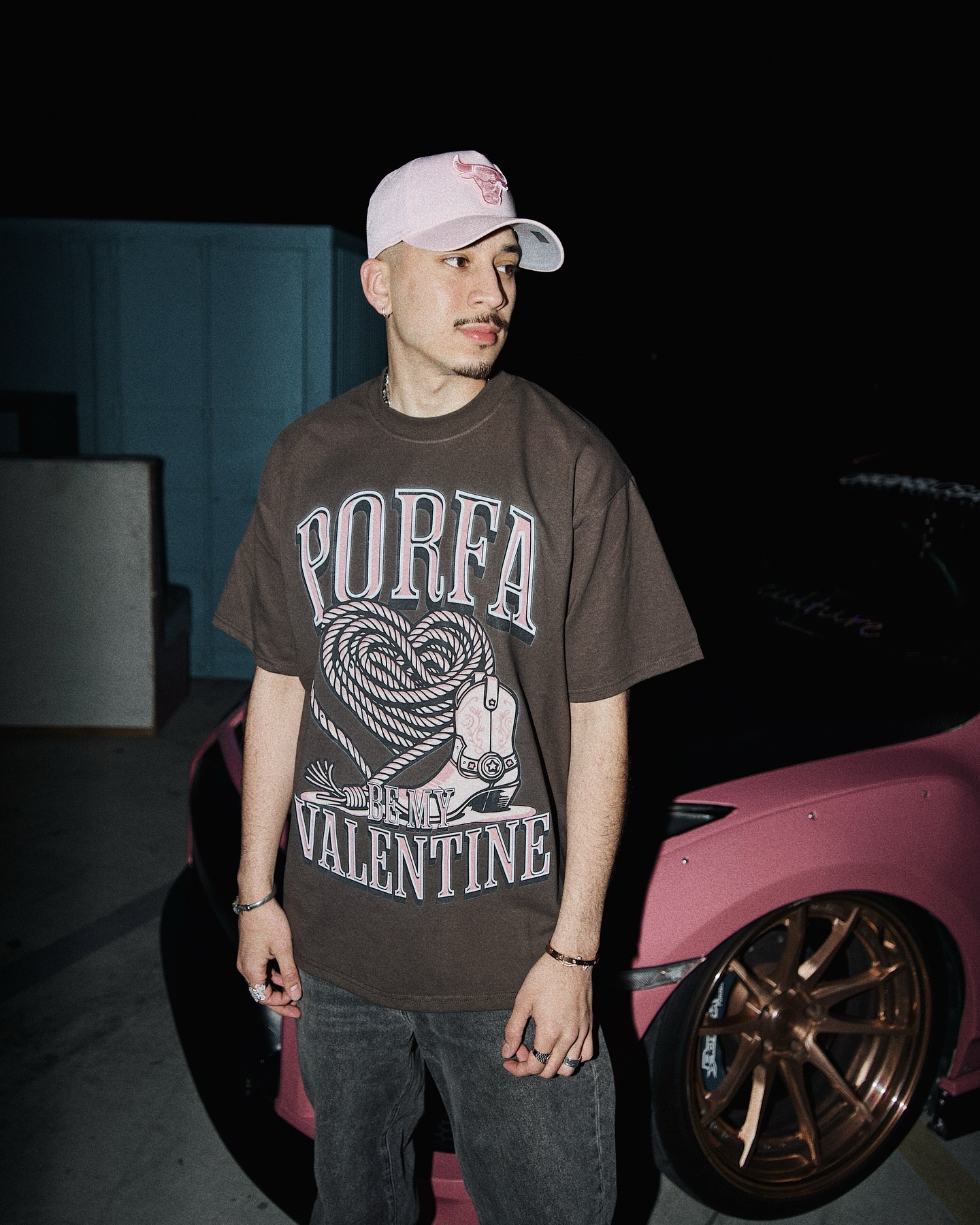 a white sign with plants and a potted plant next to it