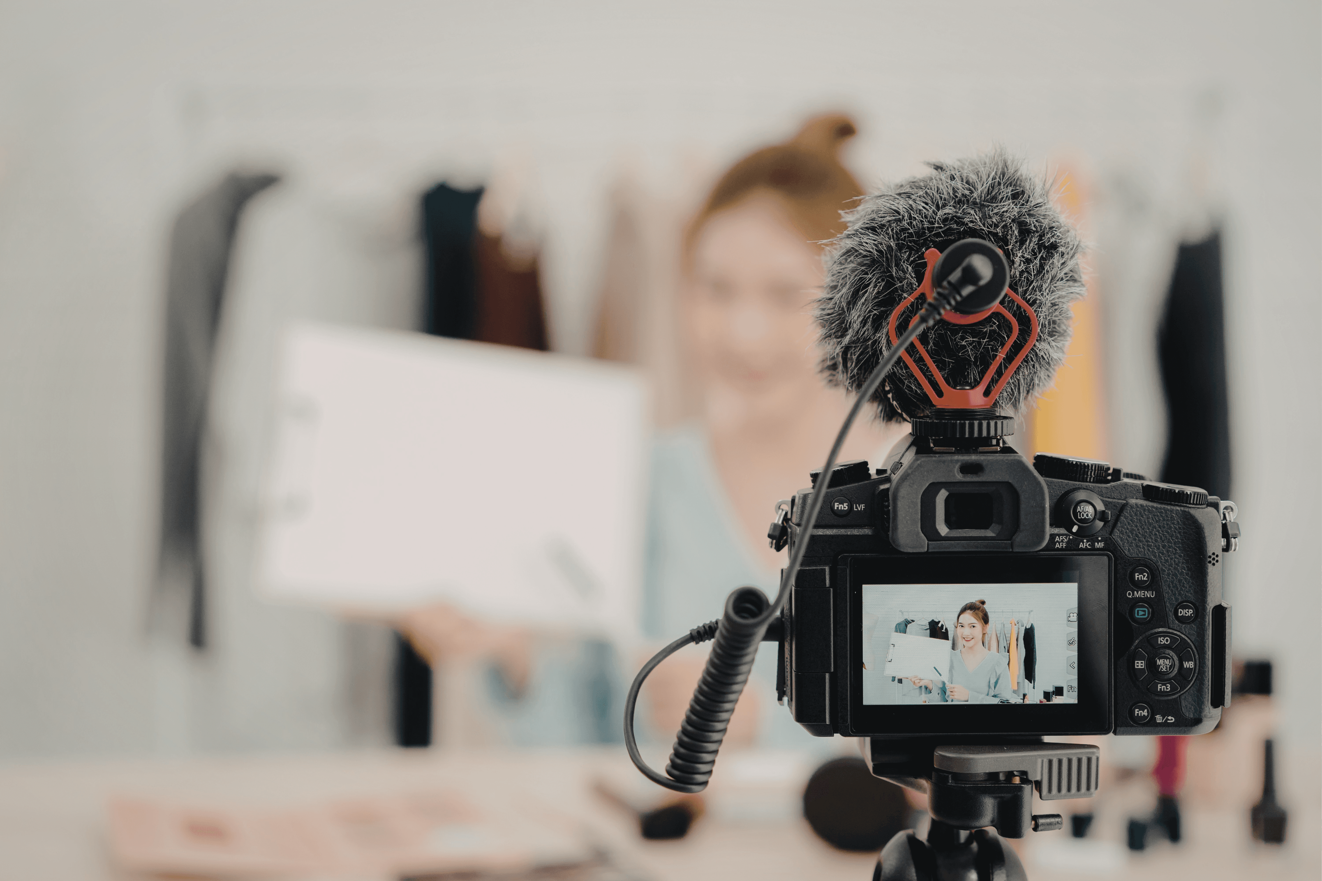 A person typing on a laptop on a desk