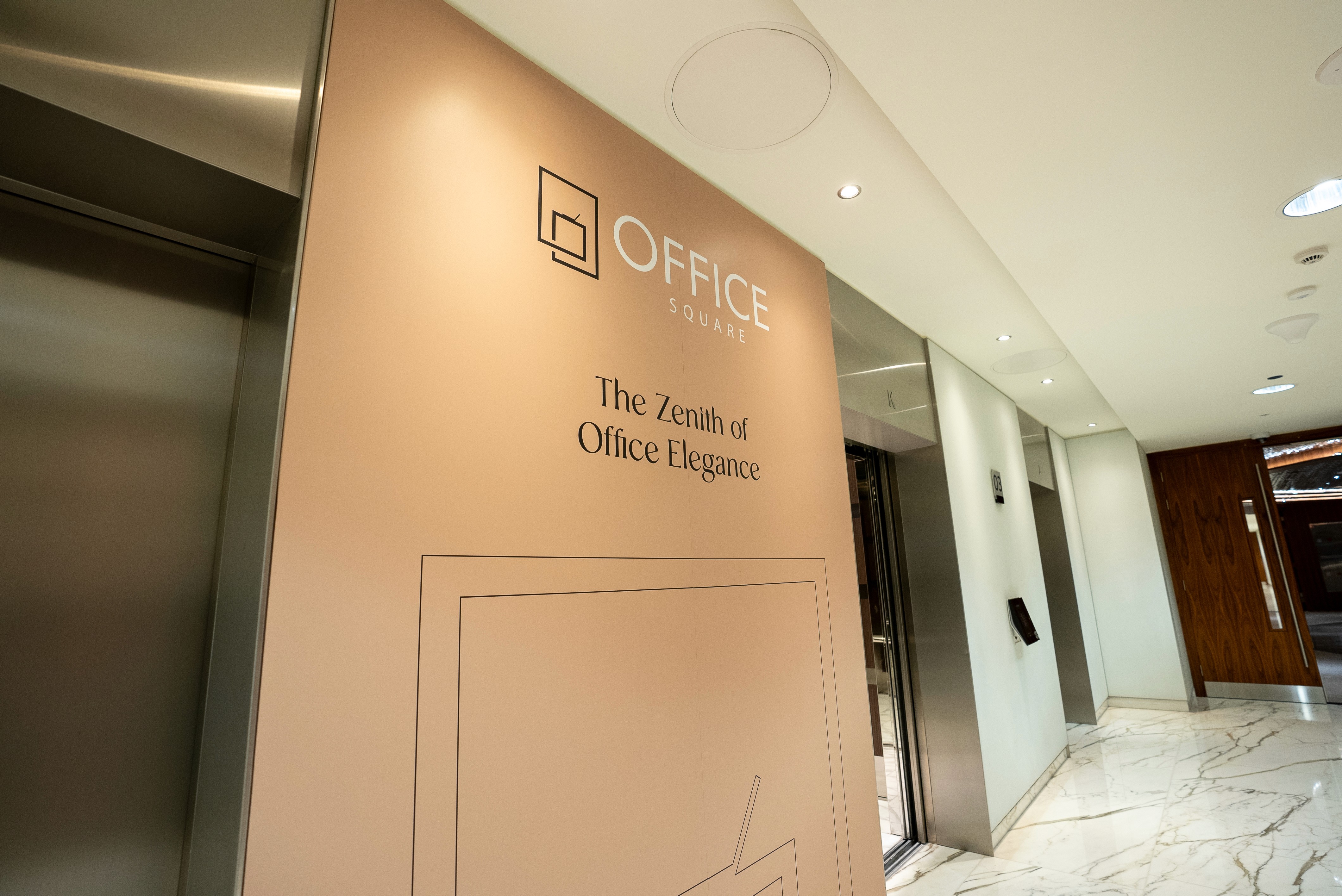 Exterior view of Al Fattan Business Hub in JBR, Dubai, surrounded by high-rise towers and modern architecture.