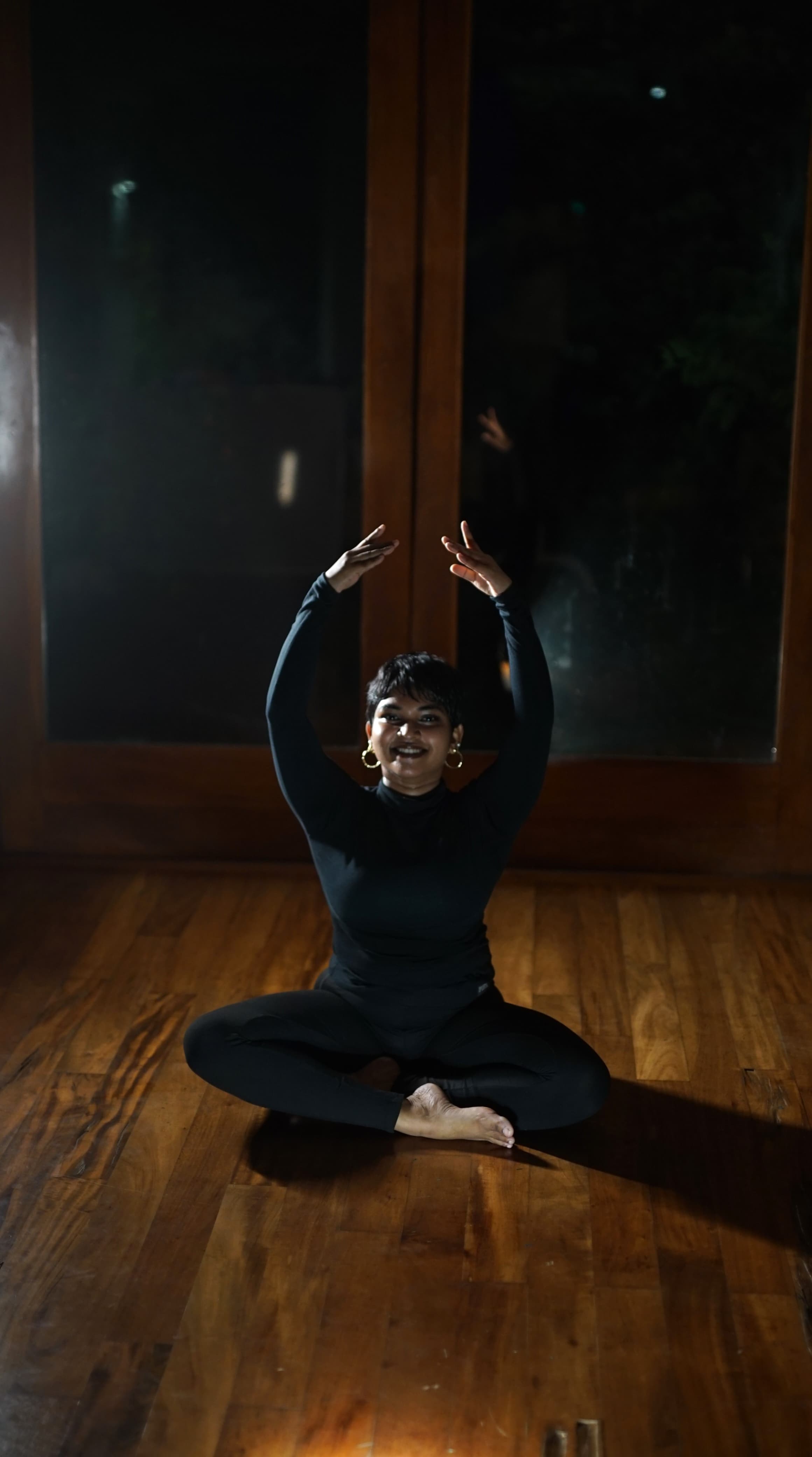 A man playing a drum in front of a group of people