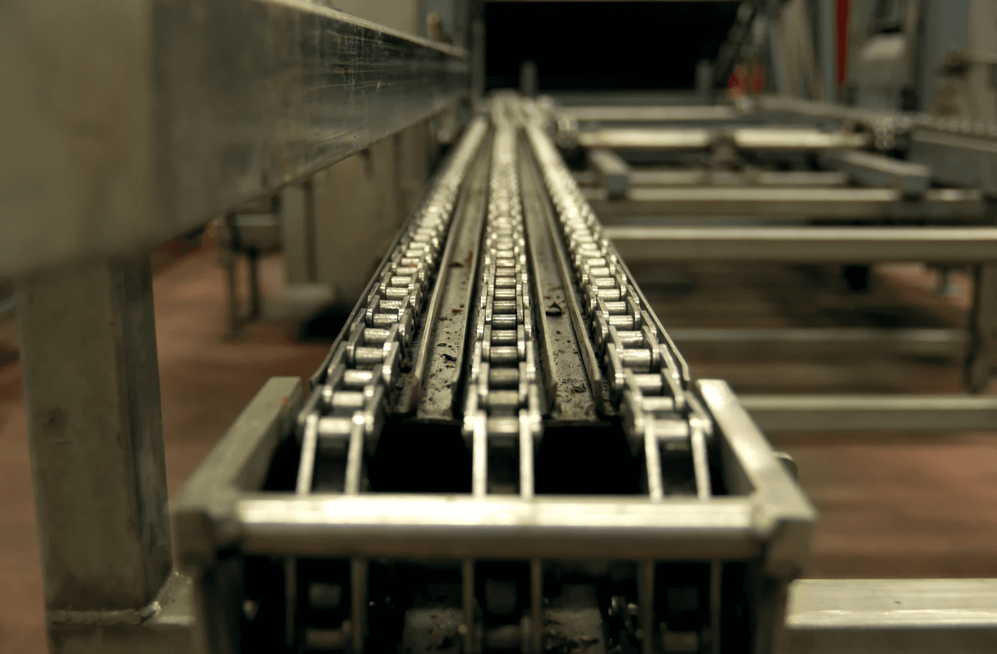 a conveyor belt in a warehouse filled with bags