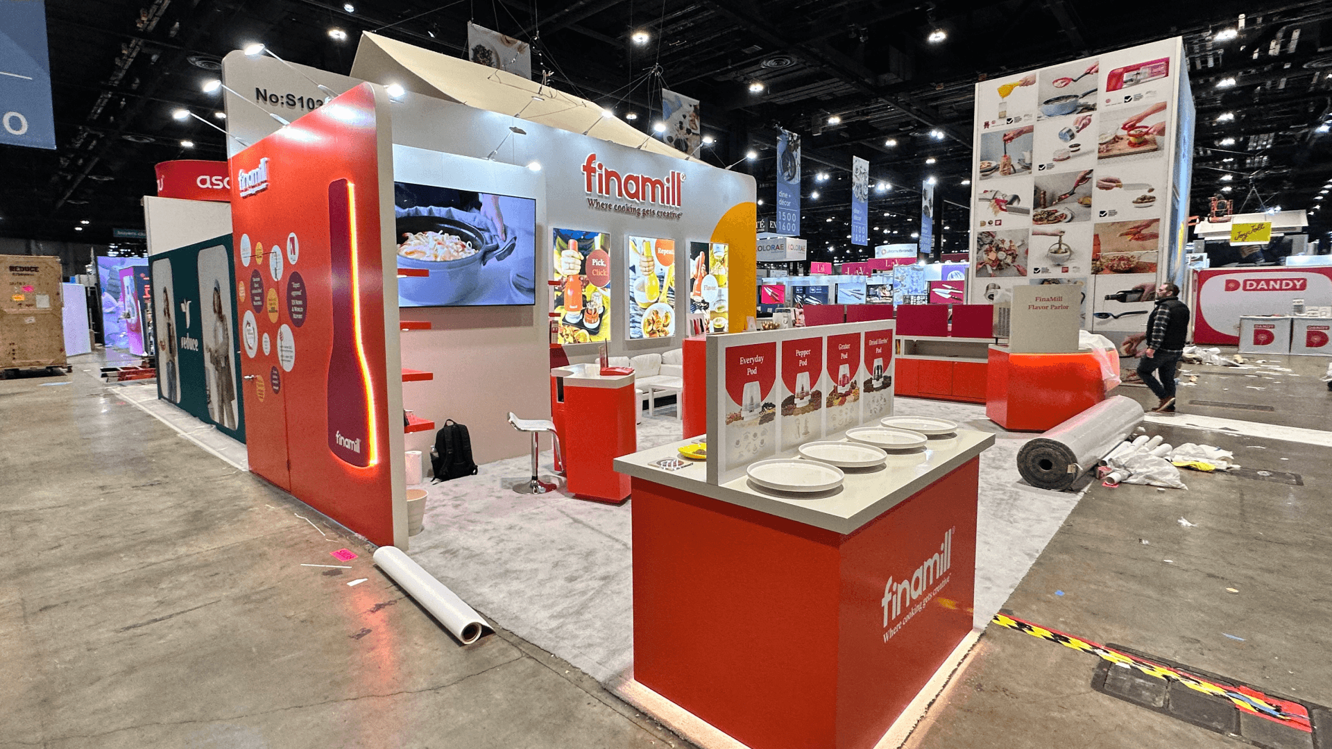 industrial baking equipment booth with conveyor system staging and equipment-ready installation sequence in convention center hall
